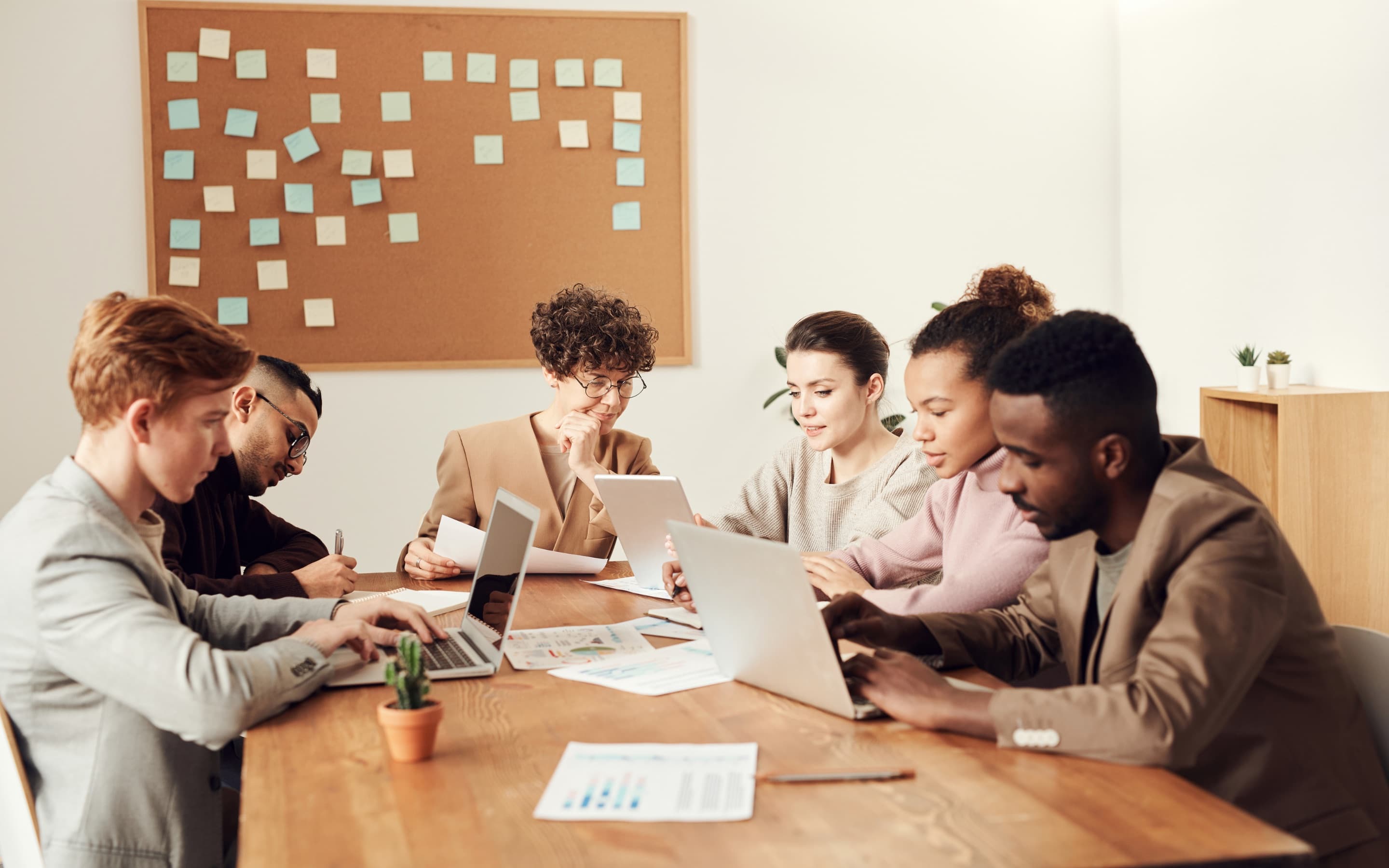 A team working together around a table in a meeting room